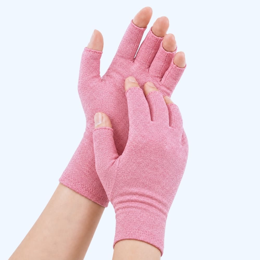 Pink compression gloves on a light pink background